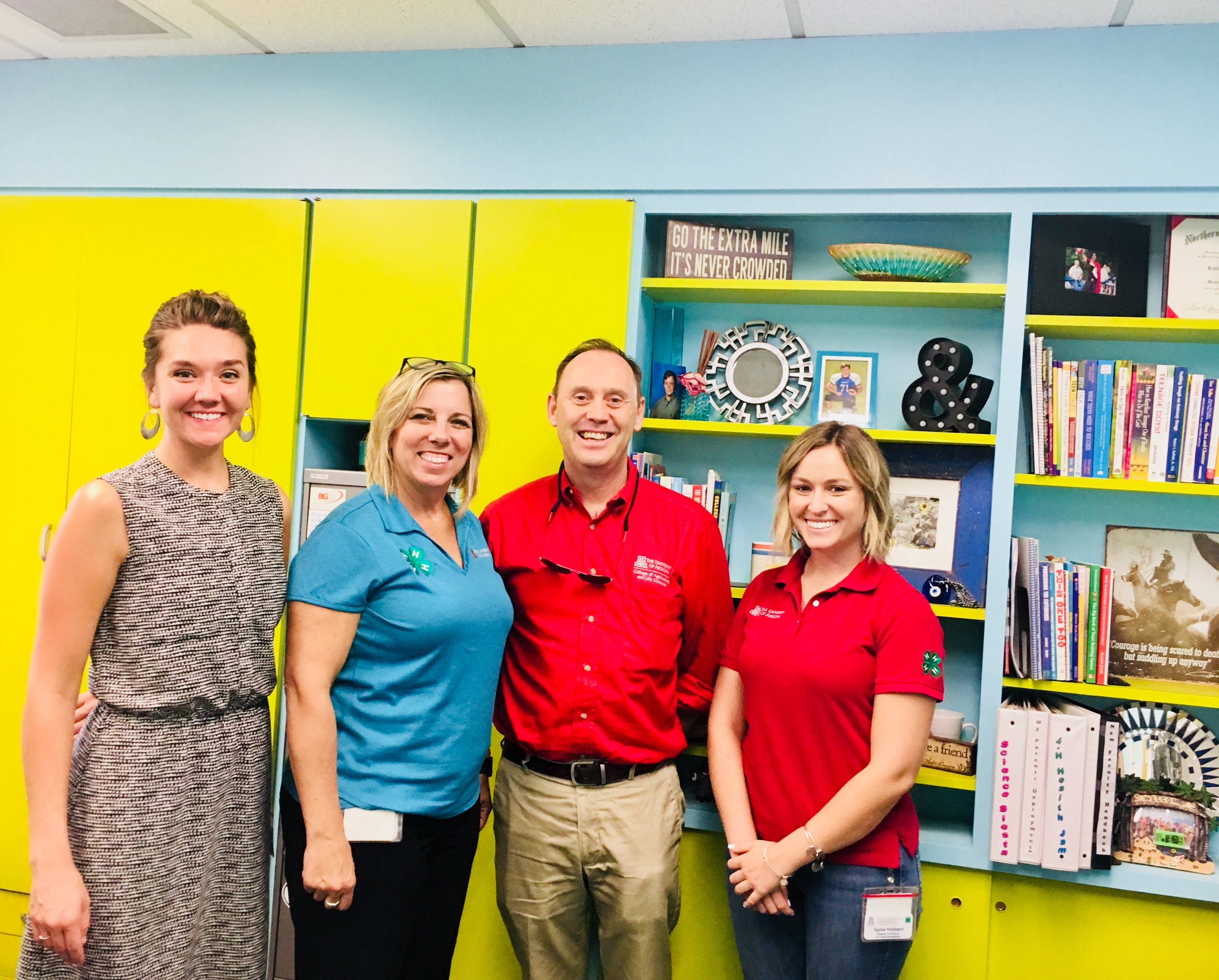 Kim Christman, second from left, and members of her Maricopa County Cooperative Extension 4-H team, Hannah Hanson and Taylor Hubbard, with UA Vice President for Agriculture, Life and Veterinary Sciences, and Cooperative Extension Shane Burgess.