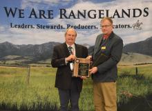 Dr. Steven Archer receiving the 2019 W. R. Chapline research Award from Society for Range Management President Dr. Barry Irving.