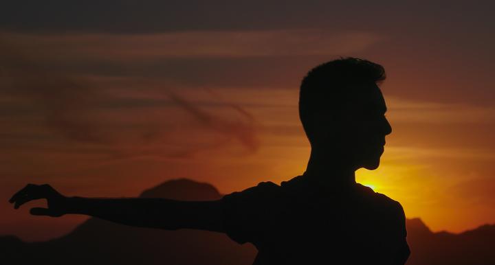 Man dancing in sunset