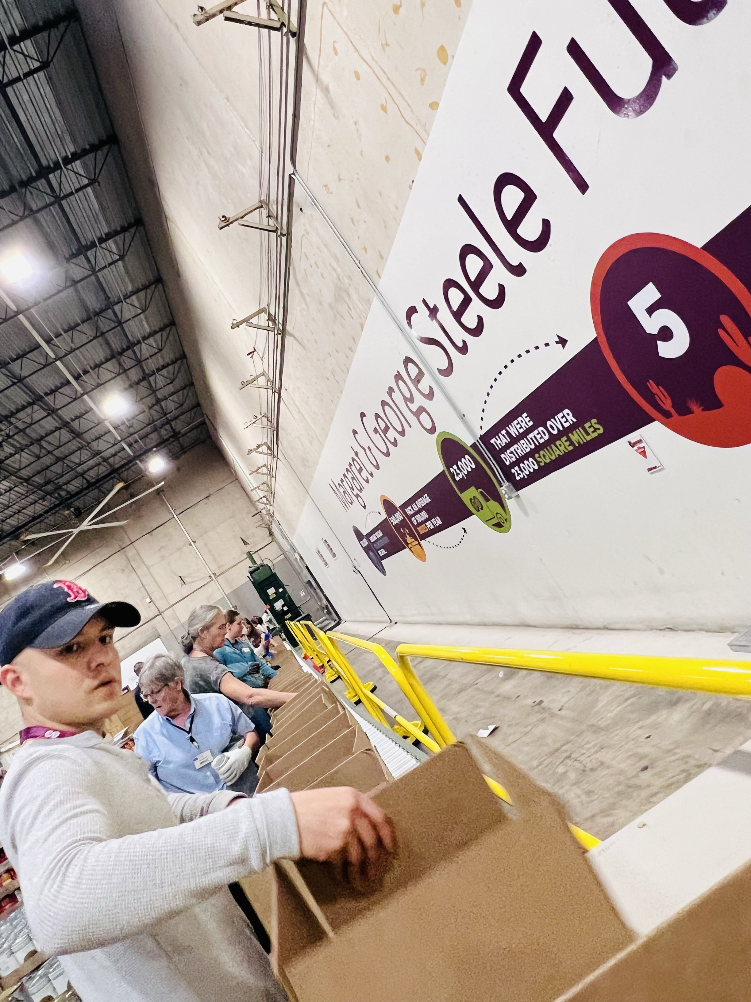 guy volunteers at food bank