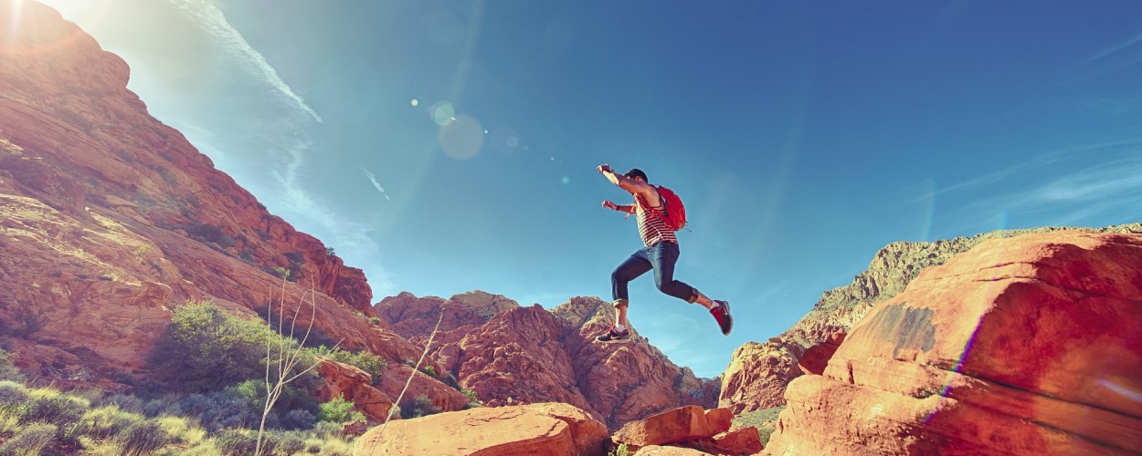 Man Jumping Boulders Joyfully