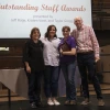 Group photo of award recipient and award presenters on stage