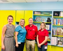 Kim Christman, second from left, and members of her Maricopa County Cooperative Extension 4-H team, Hannah Hanson and Taylor Hubbard, with UA Vice President for Agriculture, Life and Veterinary Sciences, and Cooperative Extension Shane Burgess.