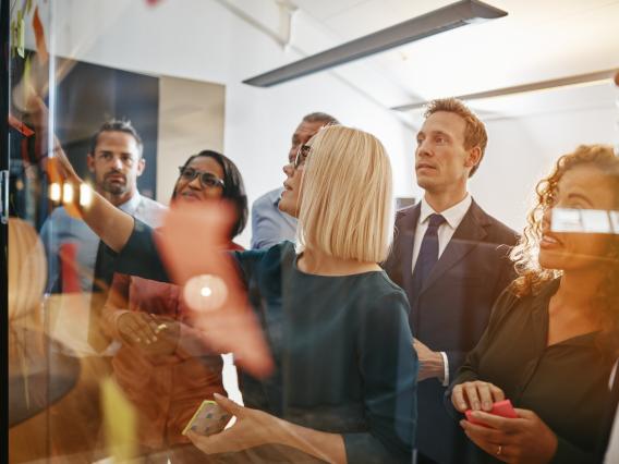 Group of people around a board