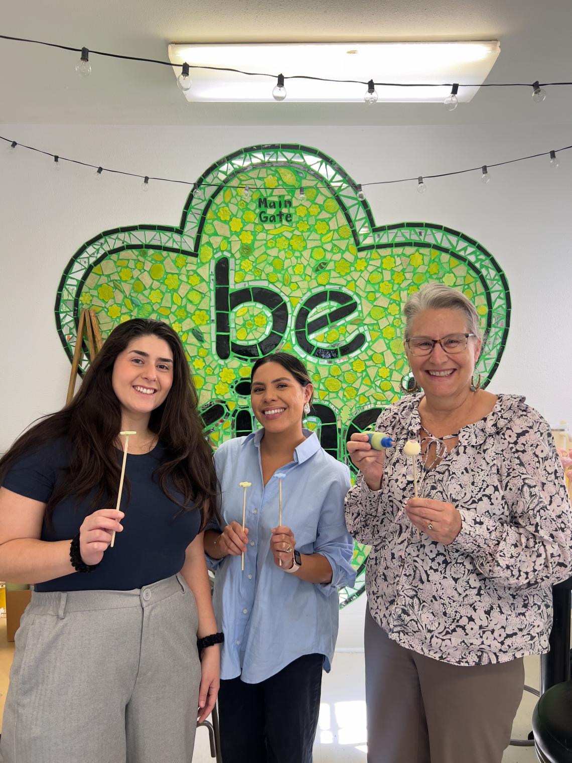 women pose at volunteer opportunity