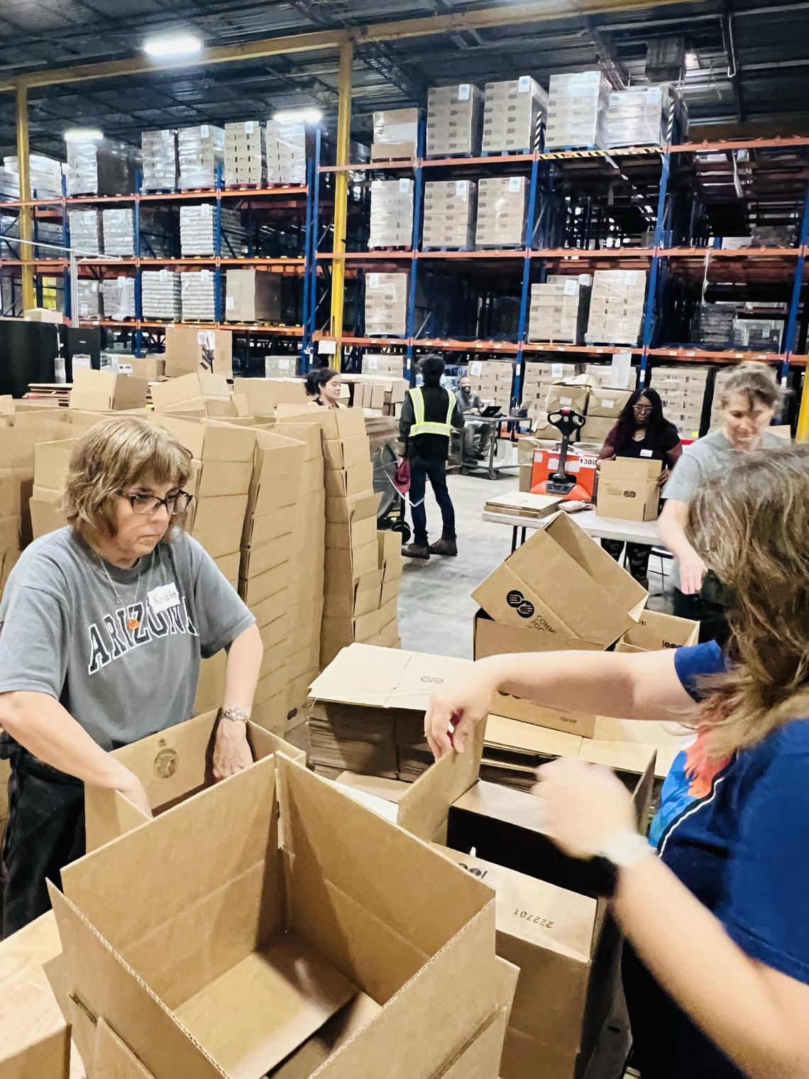 women volunteering at community food bank