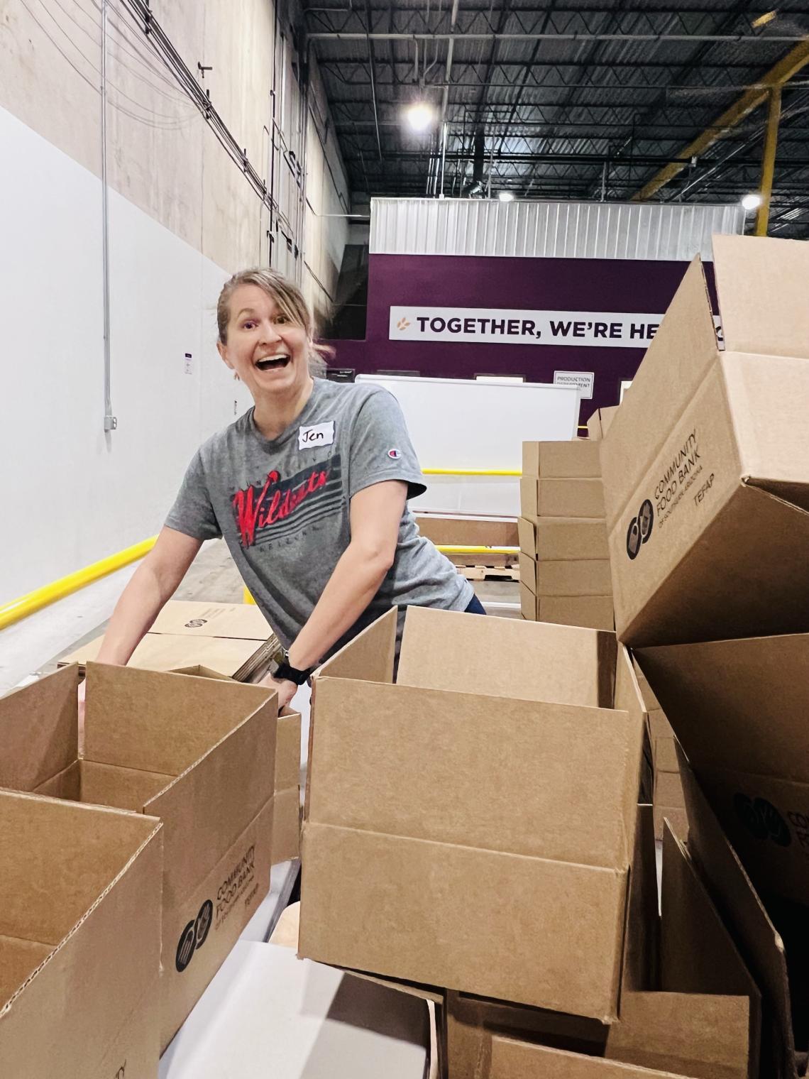 woman volunteers at food bank