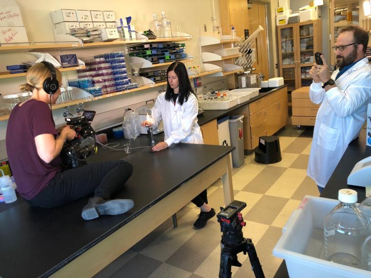 Producer shoots scene in a lab