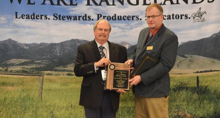 Dr. Steven Archer receiving the 2019 W. R. Chapline research Award from Society for Range Management President Dr. Barry Irving.